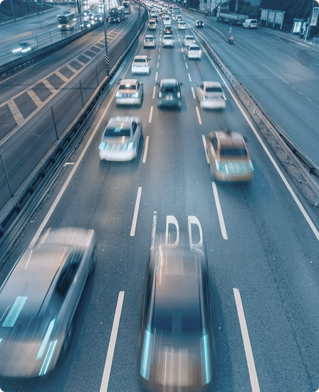 Multi-lane road with moving traffic at dusk